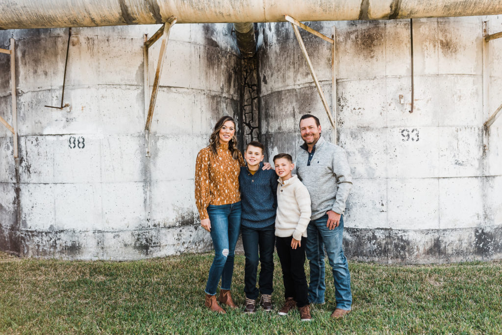 family standing spread out